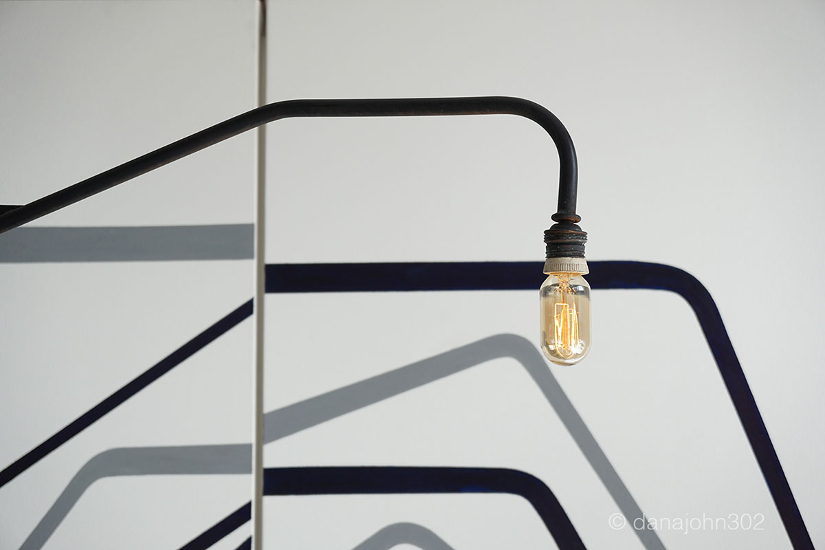 Prouvet light source in the forground and Jacques Quinet painting in the backround.