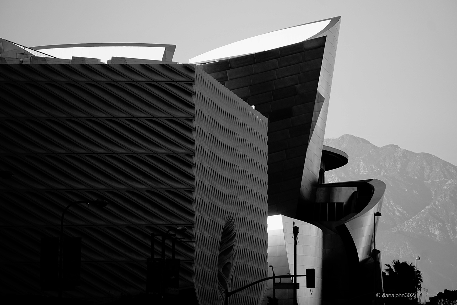 The Broad Museum in the foreground and Walt Disney Concert Hall in the backround, giving way to San Gabriel Mountains by Dana Lance for Danajohn Photography © danajohn302