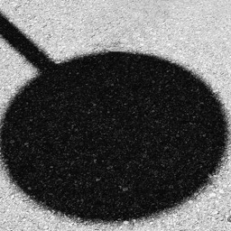 Shadow on asphalt in the form of a loli pop by Dana Lance for Danajohn Photography © danajohn302